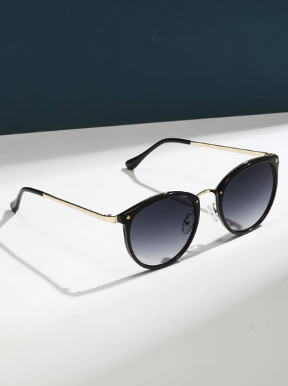 occhiali da sole alla moda con montatura rotonda da donna
